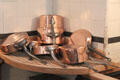 Copper pans on drain board in kitchen at Nissim de Camondo Museum. Paris, France.