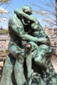 The Kiss by Auguste Rodin in front of Orangerie museum. Paris, France.