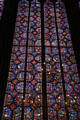 Stained glass with scenes of royal history at St Chapelle. Paris, France.