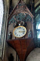 Clock with holy figures on pedestal in Reims Cathedral. Reims, France.