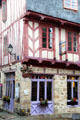 Half-timbered building with carved figures on rue Bienheureux Pierre René Rogues. Vannes, France