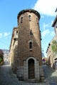Round tower on ramped street leading up to ramparts. St Malo, France.