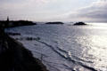 Ocean at high tide & islands at dusk. St Malo, France.