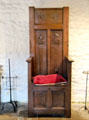 Carved high back armchair which would have been reserved for use by Master of house in Common Room at Jacques Cartier Manor House Museum. St Malo, France.
