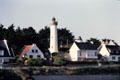 Lighthouse among cottages. Gulf of Morbihan, France.