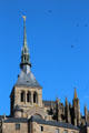Mont-St-Michel abbey with spire crowned by Archangel Michael by Emmanuel Frémiet. Mont-St-Michel, France.