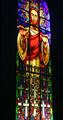 Image of Christ extending his blessing on stained glass window honoring soldiers killed in battle. Dieppe, France.