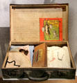French child's evacuation suitcase & kit with ID bracelet at Caen Memorial. Caen, France.