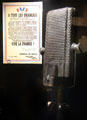 Leaflet from General de Gaulle to all French citizens printed in England beside ribbon microphone at Caen Memorial. Caen, France.