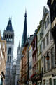 Cathedral spires beyond half-timbered buildings on rue du Gros Horloge. Rouen, France.