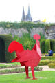 Modern style sculpted rooster in gardens of Angers Chateau. Angers, France.