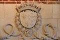 Royal emblems of ermine tail & Fleur de Lys around Franciscan corded knots in medallion on fireplace on Franciscan Antechamber fireplace in Royal Lodge at Chateau Royal of Amboise. Amboise, France.
