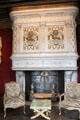Renaissance fireplace with François I salamander & Queen Claude de France ermine crests in Louis XIV's drawing room at Chenonceau Chateau. Chenonceau, France.
