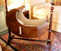 Rare Empire-style Mahogany cradle in Birth chamber at Cheverny Chateau. Cheverny, France.