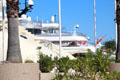Glimpse of mega-yachts in harbor. Antibes, France.