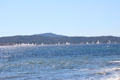 Yachts sailing in regatta seen from beach. Sainte-Maxime, France.