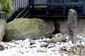 Spiral carved stones & standing stone marking entrance of Main Neolithic passage grave at Knowth. Ireland.