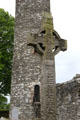 Muiredach's high cross seen before round tower at Monasterboice. Ireland.