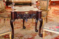 Card table with carved face at Castletown House. Ireland.