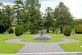 Statue with flower in garden at Emo Court. Ireland.