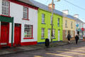 Streetscape of colorful houses facing South Square of Sneem. Sneem, Ireland.