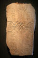 Grave slab reading "prayer for Tuathal the craftsman" in Irish at Clonmacnoise museum. Ireland.