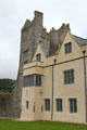 Pink Tudor manor house with original Ormond Castle beyond. Carrick-on-Suir, Ireland.