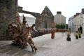 Viking sword carved from fallen fir tree by John Hayes near Reginald's Tower where an original sword which inspired this sculpture is displayed. Waterford, Ireland.