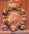 Ornately carved wooden shield with the phrase "Honi Soit Qui Mal Y Pense, the motto of the Order of the Garter, a high British honor & symbols of the four nations comprising the UK at Bunratty Castle. County Clare, Ireland.