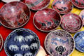 Painted clay dishes with animal themes at a crafts market near Nairobi. Kenya.
