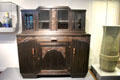 Black oak glass-fronted dining room display cabinet made by Mathias Marx at National Museum of History & Art. Luxembourg, Luxembourg.