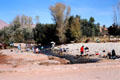 Women doing laundry at Gorge du Todra. Morocco.