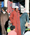 Men in traditional dress in souk. Erfoud, Morocco