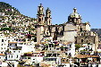 View of town of Taxco & its church from afar. Mexico.