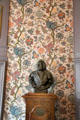 Male bust against a pattern of floral wall paper in home of Pieter Teyler at Teylers Museum. Haarlem, Netherlands.