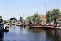 View of windmill & barges on Rijn Galgewater. Leyden, Netherlands.
