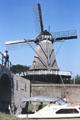 Windmill beside a bridge. Sloten, Netherlands.