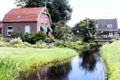 Houses along canal in Westbroek. Westbroek, Netherlands.