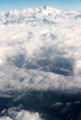 Clouds almost hide Himalayas over Nepal.