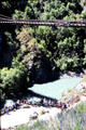 Spectators look on as people bungy jump from Kawarau suspension bridge. New Zealand