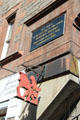 Sign on Royal Mile pointing to Lady Stair's Close where Writers' Museum marks site that Robert Burns lived on his first visit to Edinburgh. Edinburgh, Scotland.