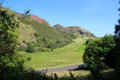 Salisbury Crags with Arthur's Seat extinct volcano. Edinburgh, Scotland.