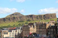 Salisbury Crags & Arthur's Seat over roofline of Edinburgh. Edinburgh, Scotland.