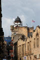 Upper end of Royal Mile approaching entrance to Edinburgh Castle with Outlook Tower of Camera Obscura & World of Illusions building. Edinburgh, Scotland.