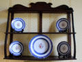 Hepplewhite hanging shelves with Chinese export porcelain in bedchamber at Georgian House museum. Edinburgh, Scotland.