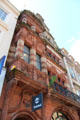 Flemish gable-fronted commercial building with banded red & white sandstone. Glasgow, Scotland.