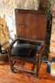Tilt-top table which opens to become armchair with tall back at Provand's Lordship. Glasgow, Scotland.
