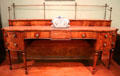Mahogany sideboard made in Scotland with tureen by Delftfield Pottery of Glasgow at Kelvingrove Art Gallery. Glasgow, Scotland.