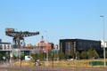 Clydeport Finnieston crane, brick Tower of the Winds & Village building. Glasgow, Scotland.
