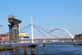 Bells Bridge with white spike erected for Glasgow Garden Festival with Clydeport crane & Glasgow Arc bridge beyond. Glasgow, Scotland.